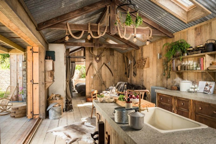 Rustic charm cabin kitchen open decoholic onto barn deck doors opening double plan front